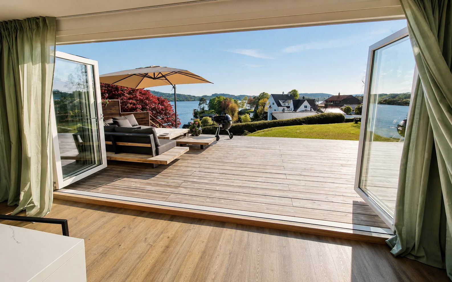 Open doors onto the deck with water views