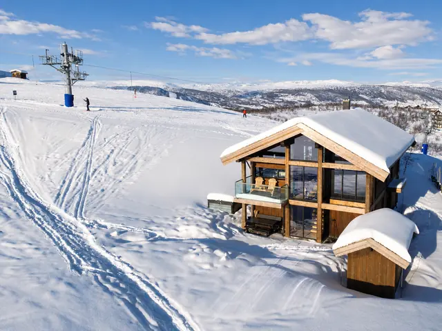 Kikut Chalet in deep snow beside the ski lift