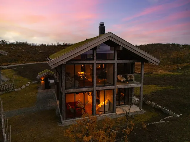 Kikut Chalet glowing at dusk